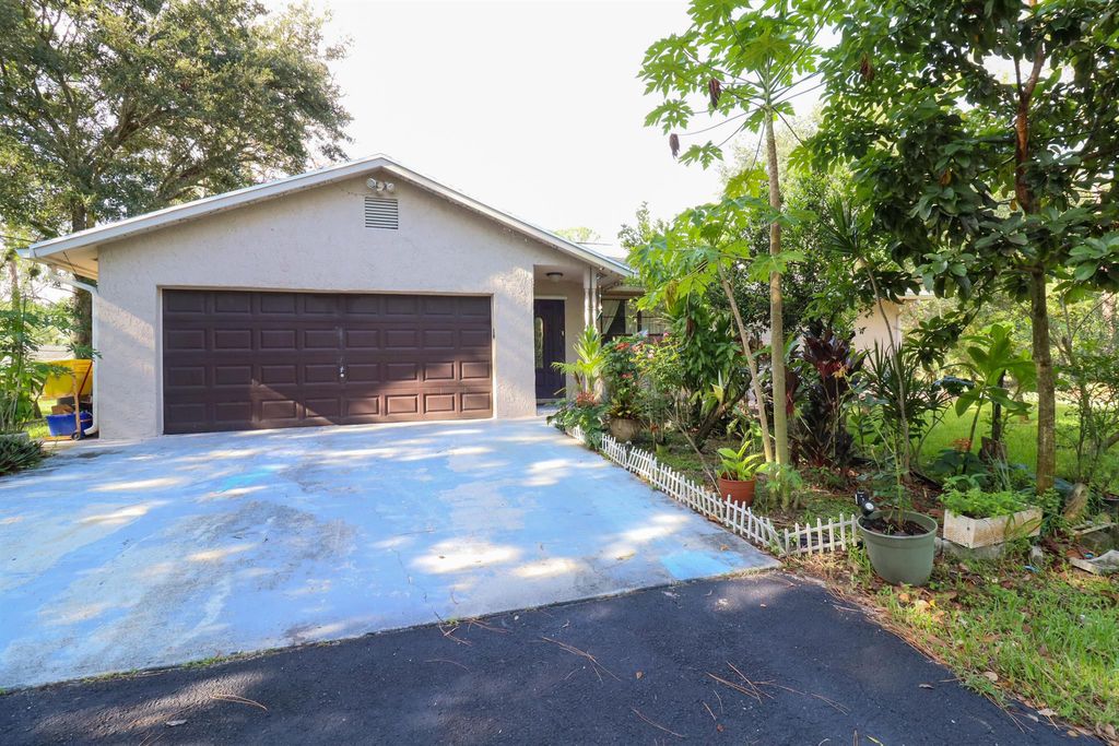 Photo of 12736 Orange Boulevard, West Palm Beach, FL 33412 (MLS # R10904489)