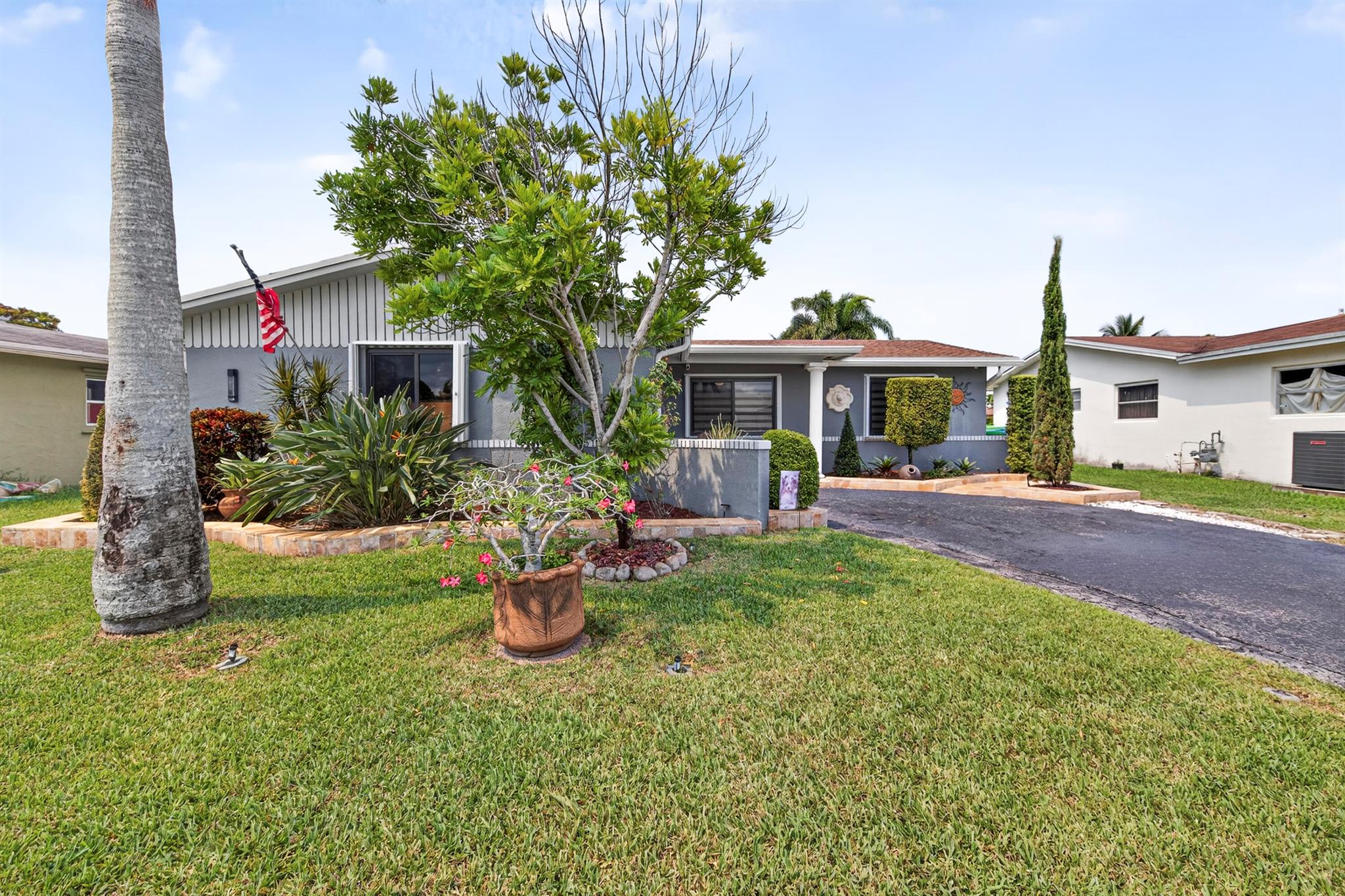 Beautifully maintained and updated 4-bedroom, 2-bathroom single-family home in the heart of Sunrise, Florida. Situated on a tranquil canal waterfront lot, this home offers the perfect blend of indoor comfort and outdoor living. Step inside to find LVP and wood laminate floors, adding warmth and durability throughout. The home has been thoughtfully updated with impact windows and doors installed in the last year, plus hurricane shutters for added protection. The shingle roof is approximately 10 years old, the A/C was replaced in 2019, and the water heater was updated in 2013 -- offering peace of mind for years to come. Enjoy a spacious kitchen and open living areas perfect for entertaining. Outside, enjoy your pool or cast a line from your own backyard.