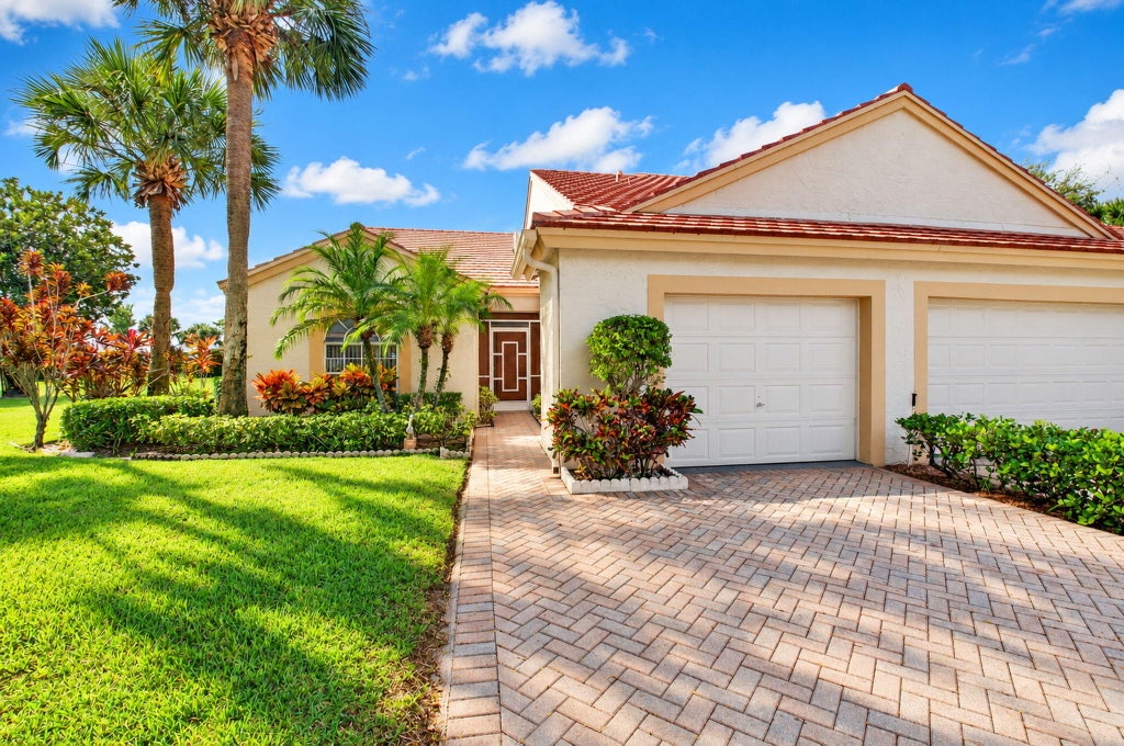 Photo of 7700 CORAL LAKE Drive, Delray Beach, FL 33446 (MLS # B26088903)