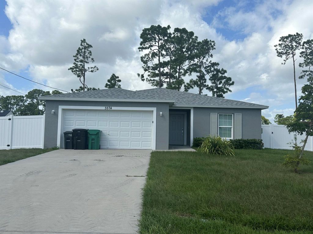 Photo of 3574 SW Masilunas Street, Port St Lucie, FL 34953 (MLS # R10933128)