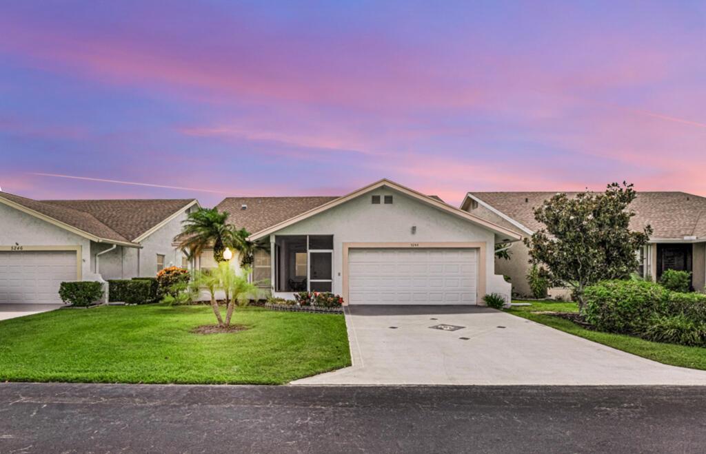 NO MEMBERSHIP TO PLAY GOLF!l lovely, well-maintained 2 BR, 2 full bath , 2 car garage home in the very desirable gated community of Cypress Lakes. Filled with natural light through energy-efficient double-paned windows and sky lights, this home also offers outdoor living with 2 screened patios surrounded by tropical landscaping. Easy-care laminate flooring graces the tastefully updated kitchen, great room, living room and hallways. Note: New AC in 2023, newer washer/dryer, 2017 solar tube replacement, new ROOF in 2005 and accordion shutters. Stroll around the scenic lake, play a morning round of 18 holes, take a refreshing dip in the swimming pool, work out at the fitness center, join a game of pickleball or tennis, or check out the activities at the clubhouse. Welcome home