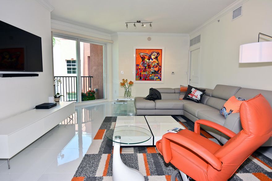 Rare find with this annual rental.  Recently updated 5th floor 2/2 penthouse condo with large rooftop terrace one block off Atlantic Ave and right in the heart of Pineapple Grove. Short walk to the beach. Unit overlooks a garden view.  Light and bright throughout wit ROOF TOP TERRACE. Terrace includes hot tub and large relaxation area. Enjoy all that Delray has to offer.