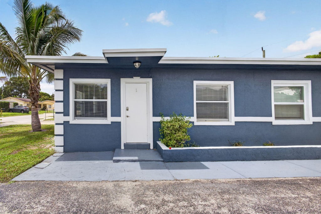 Photo of 112 W 34th Street #1, Riviera Beach, FL 33404 (MLS # B26018354)