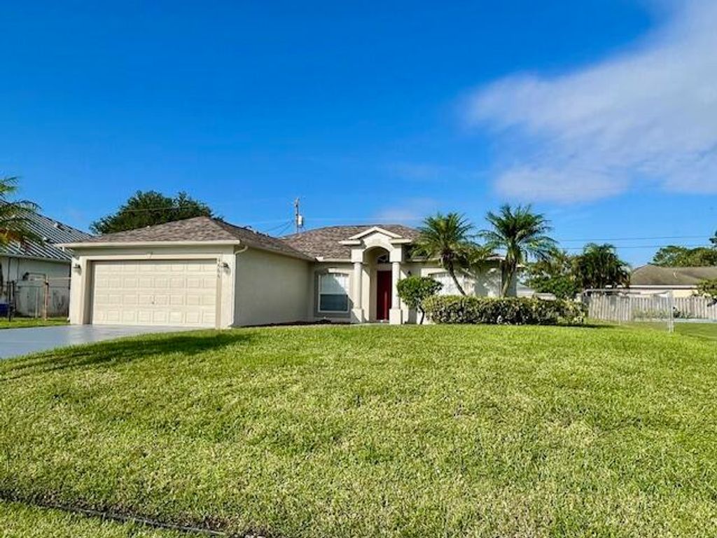 Photo of 4666 SW Pearl Street, Port Saint Lucie, FL 34953 (MLS # R10929432)