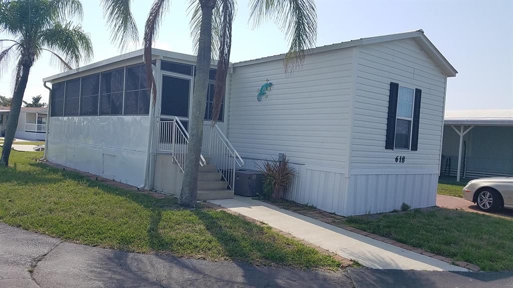 Photo of 618 NE Tahiti Way, Jensen Beach, FL 34957 (MLS # R10708716)