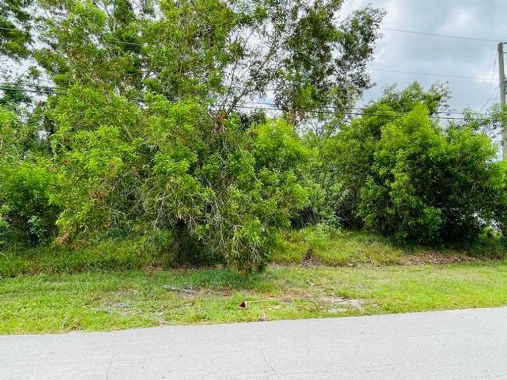Photo of 5797 NW Coosa Drive, Port Saint Lucie, FL 34986 (MLS # R10717669)