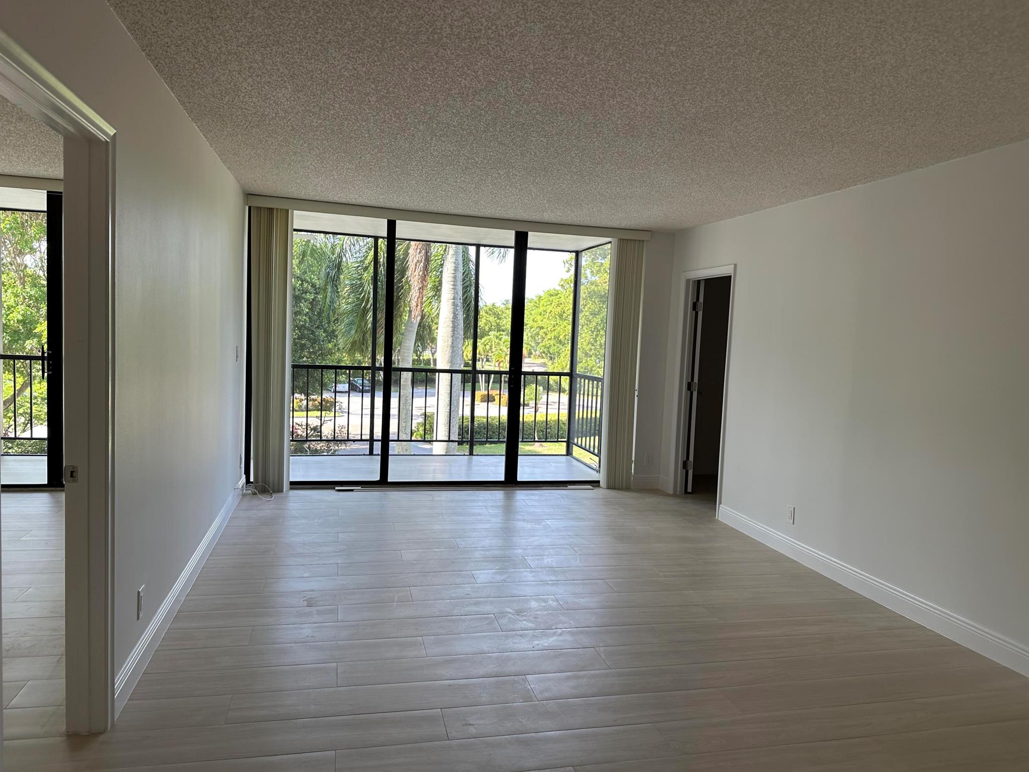Not your typical midrise corner apartment! This unique residence features a versatile bonus room--perfect for a media room, home office, or cozy den. The kitchen terrace has been thoughtfully enclosed to create a charming dining area. Both bathrooms and flooring have been recently renovated, adding a fresh, modern touch. Enjoy a tree-lined front view for privacy and a picturesque side view overlooking the pool and golf course. ~ Imagine life inside the Nation's #1 Private Residential Country Club Lifestyle offering resort-style living. Conveniently located less than 10 minutes from downtown Boca Raton. ENJOY endless activities in over 450,000 sq. ft. of exceptional amenities & stellar service. Mandatory Joining Fee: $150,000, BWMA Capital Contribution: $10,000, Annual Social Dues: $24,454.