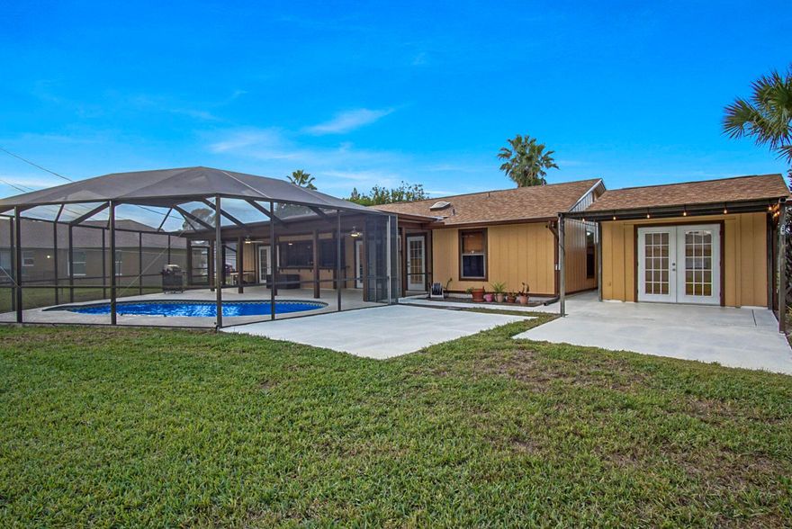 WOW! Great 3 Bedroom 2 Bath home. In ground pool with new screened lanai and Large patio.  Granite countertops, solid wood cabinets, new appliances including 2 refrigerators, awesome detached office with a private entrance. New Roof! Newly Painted!  Includes two 70'' TV's, 90 Gallon Propane tank with BBQ Grill and to hook up to your generator. Security cameras. Sky light in Cabana bath along with two shower heads. Washer and Dryer included.  Nice Quiet Neighborhood! SO Many Great Features with this home you won't want to miss this one! Call Today to schedule a showing.