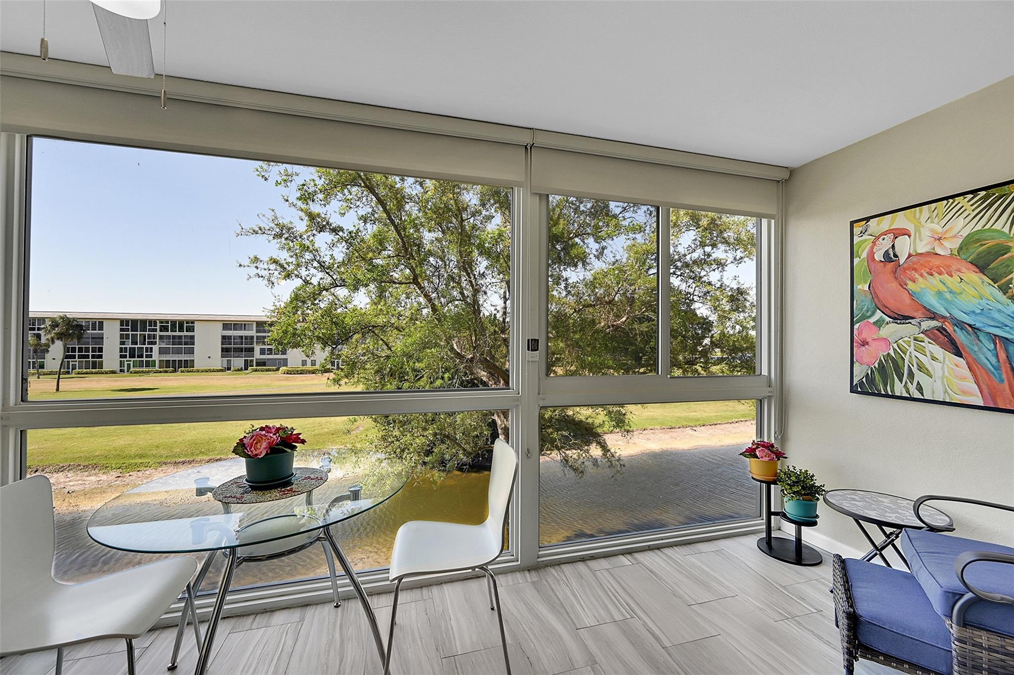 DESIRABLE, TURN-KEY/FULLY FURNISHED, TASTEFULLY DECORATED & TOTALLY REMODELED 2BEDROOM/BATH WITH PANORAMIC GOLF/LAKE VIEWS LOCATED IN THE HEART OF WYNMOOR. BEAUTIFUL OPEN KITCHEN WITH NEWER CABINETS + SS APPLIANCES AND QUARTZ COUNTERTOPS. PORCELAIN FLOORS THROUGH-OUT. REMODELED AND DESIGNED BATHROOMS WITH NEWER VANITIES + SHOWERS. COME SIT IN THE BALCONY AND ENJOY THE BEAUTIFUL VIEWS FROM THE ENCLOSED LANAI WITH HIGH IMPACT WINDOWS AND BLINDS. A/C (2017), WH (2019) +ELECTRICAL PANEL (2022). WYNMOOR IS A 55+ COMMUNITY THAT HAS TONS OF AMENITIES LIKE: RESTAURANT, GOLF, TENNIS + PICKLEBALL COURTS, CLUBHOUSE, THEATER, FREE TRANSPORTATION AND MUCH MORE. THIS IS PERFECT FOR SOMEONE LOOKING TO BRING JUST HIS SUITCASE. A MUST SEE!