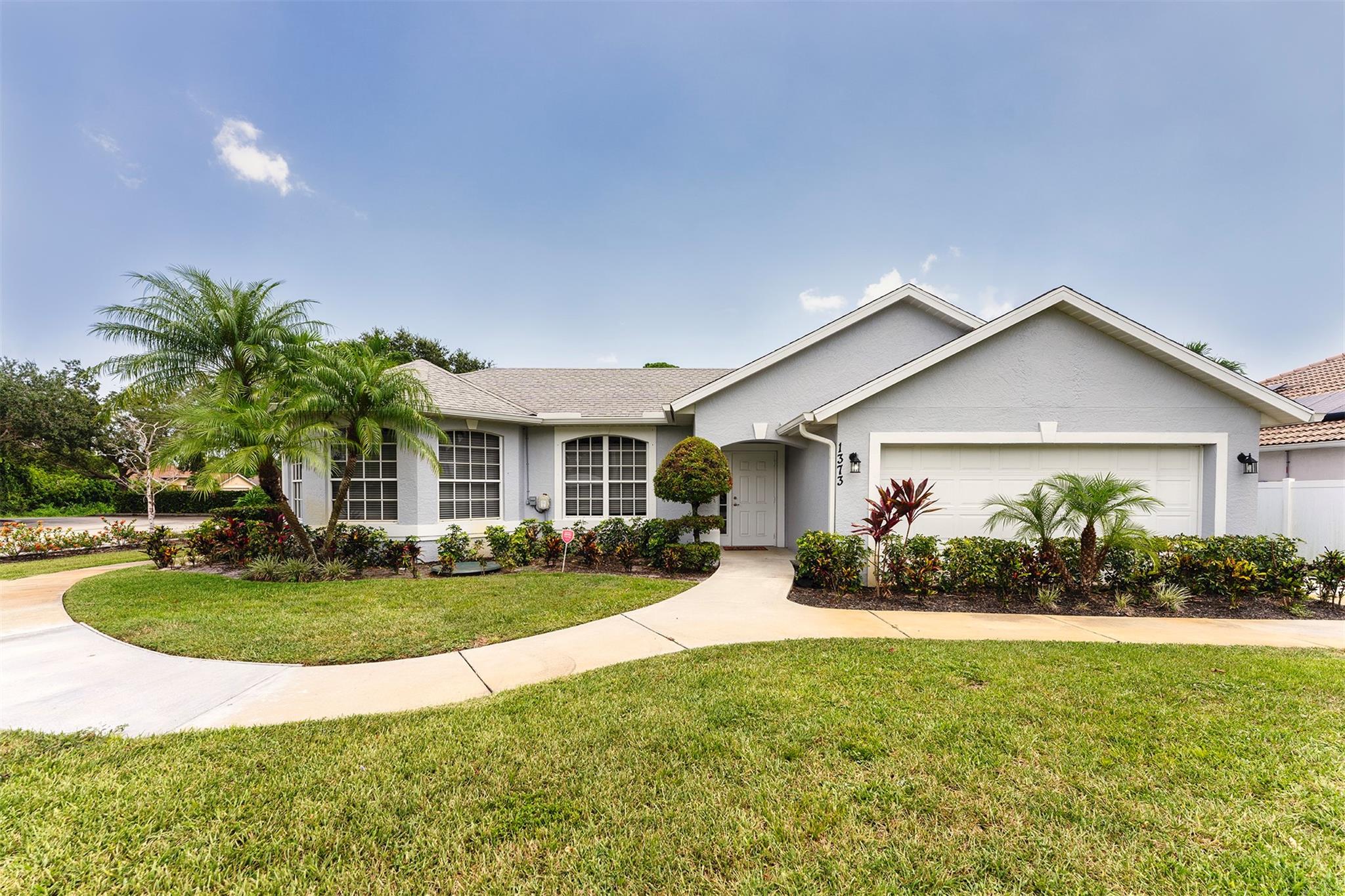 RENT REDUCTION ! Welcome to this beautiful 3 bedroom, 2 bath home with ample parking for up to a dozen vehicles , a boat and an RV in the separate parking lot. The home boasts a spacious and open floor plan, perfect for entertaining guests or relaxing with family. The kitchen features modern appliances and plenty of counter space for preparing meals. The bedrooms are generously sized and offer plenty of natural light. Former model home with a finished garage with A/C and tile floor. The large separate parking lot is perfect for car enthusiasts in need of additional parking space. The property is conveniently located on a corner lot close to shopping, dining, and entertainment options. Don't miss out on the opportunity to rent this home. NO PETS ACCEPTED.