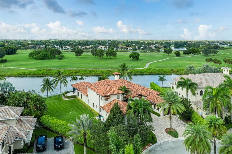 Mrachek custom remodeled, cul-de-sac, waterfront home on .61 acres (26,569sf) in exclusive Heron Estates. 6,713sf home features 5BR, 5.2BA, library & loft. Pristine layout, attention to detail featuring elegant marble/wood finishes and DCOTA lighting/plumbing fixtures and window treatments. Chef's kitchen features Wolf gas range/oven/hood and Sub-Zero refrigeration/wine/ice. Owner's Suite boasts sitting area, spa-style bathroom with stunning Calacatta marble feature wall. Built for entertaining, freeform pool/spa, screened patio with summer kitchen, and fenced grounds showcase sunset views over 300' linear waterfront overlooking passive park (walking/riding/pet-friendly). Meticulous in every way. Impact glass, circular drive and 3-car garage complete the offering. Furnishings available.
