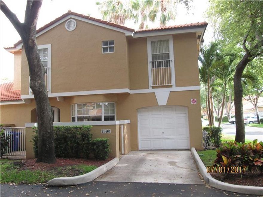Beautifully maintained 4 bedroom 2.5 bathroom town home in prestigious Coral Springs! This unique corner property was the builder's model. Garage converted to 4th bedroom. Living room has French doors and soaring volume ceilings. Newer appliances, fabulous kitchen cabinet and counter space. Master suite with built-ins, wet bar, walk-in closet, roman tub. Gorgeous home! A/C 2021. No lease; 1st year owned.