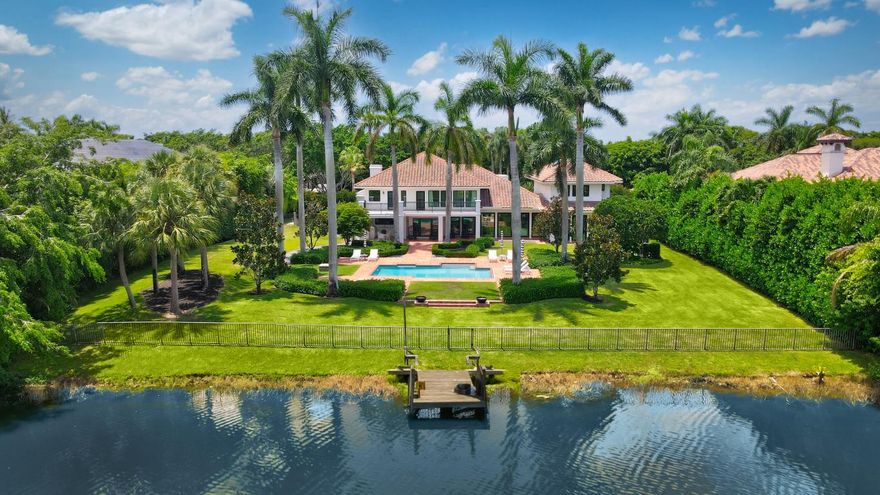 One of the finest renovated acre estate lake homes in south Palm Beach county under $10m.   Privacy, space and security highlight this special gated community and lifestyle with classic mature trees and landscaping.   A two story entry foyer opens to a dramatic great room, which overlooks the backyard pool, patio and lake.  The main first floor of oversized porcelain tile, features an upgraded kitchen with eat in area, dining, media area, office, separate club/entertainment room, exercise room, a full bedroom suite, and full three car garage.  
Two separate second floor wings consist of four en-suite bedrooms in addition to the spacious primary suite with balcony access and a secondary office media room.  See MORE for additional details. Lot size : 300 x 153 x 300 x 153
Private cul-de-sac 
Iconic tree lined road to residence 
Circular driveway 
2 story fully renovated
Mature and updated  landscaping
S tile roof
3 car garage with impact glass doors
New custom Impact glass - whole house
Fenced backyard with Clusia hedging
Guardian quiet source Generac power generator - partial home
6 Carrier AC units
NEST thermostats 
Reem performance hot water heater 
ADT security system 

Propane tank 1000 gallons
Bult in basketball backboard
Septic field - 3 tanks (south side of the house)
Extensive Pool patio area 
Front fountain 
Gated entry main residence

Summer kitchen
New Gas grill 
Covered loggia with Marble backsplash and counter tops 
Multiple covered sitting areas 


Oversized 48 x 48 porcelain tile - matte finished through out 
2 story foyer
Built in shelves and cabinets in utility room storage 
Brand new Mitsubishi Air Conditioner for garage
Culligan water softener $10,000
Wine cooler negotiable 
2nd refrigerator - negotiable
Garage tv included 
Lift master quiet garage door opener 

Great room 23 x 22
Tongue and groove white ceiling 
Overlook the backyard pool, patio and expansive lake vistas

Dining room - formal 16 x 12 

Family room 15 x 21
TV included
Wood paneling accent wall with under lights and integrated TV
Powder room with floating cabinets
Led contemporary light fixtures

Kitchen 
Walk in pantry or storage
Solid Hardwood cabinets 
Subzero refrigerator 
Cristallo Quartz Countertop and waterfall island
Backsplash quartz 
Kraus sink 
Fulgor Milano - 4 Gas burner cooktop 
Exhaust to exterior 
GE profile microwave 
Thermador double wall oven 
Bosch Dishwasher 
Eat in kitchen window connects to summer kitchen loggia overlooking the pool area

Utility/ Laundry room with 2nd refrigerator
LG refrigerator stays 
Ample storage cabinets 
Samsung washer and dryer  
Granite countertop full 
Breakfast area 10 x 10

Bedroom on ground floor 12 x 10
Built in workstation

Office/den 10 x 12
Built in wood cabinetry 
Double glass door entrance with privacy lock

Club room 30 x 16
All Tv's Convey
Cristallo quartzite countertop bar 
Solid Display shelves with led lighting
Wine cooler and separate ice maker

Cabana bath with shower - full bathroom floating counter cristallo
Handheld and separate rain shower
Frosted exterior glass door

Wellness room 16 x 13
Electronics and equipment room

Smooth walls through out 
White matte ceilings , new drywall and plaster through out 

Curved wood veneer staircase
Upstairs loft 
Circular skylight 
2 separate bedroom suites with ensuites
Updated modern bathrooms 
Porcelains floors and showers
Cristallo counter tops 
Backlit mirrors
Engineered natural oak floor - upstairs 

2nd bedroom suite w/ walk in closet 14 x 12
Engeneered natiual oak floor
Ensuite bathroom porcelain floors
Cristallo Quartz countertop w/ backlit mirrors

Contemporary stainless steel and glass railing to 2nd floor 
Hardwood main staircase

4rd  & 5th bedroom - Jack and jill 13 x14 &18 x 11
Mosaic tile in bathroom
Floating wood cabinets with under lights 
Large backlit smart mirror
Both with walk in closet and built ins

Upstairs built in  linen closet 
Double glass door to office/Library (2nd office) 17 x 14
Built in wooden bookshelves and desk workstation

Primary suite 19 x 22
27 x 7 covered balcony 
Double door entry to primary suite 
Primary bathroom 
Soap stone porcelain tile 
Separate standing ceramic soaking tub
Dual integrated sink vanity 
Dual backlit mirrors that connect to phone
Dual Walk in closets
Built in cabinets
Bathroom walls are porcelain 
Walk in shower with handheld and rain shower
Frameless glass door
Backlit mirrors 
Separate dual toilet water closet 

POOL  17W x 32L
Resurfaced
Gas Firepit area
Steps that lead to wooden dock
Rear of property fenced in
East Water views
Royal Palm lined view