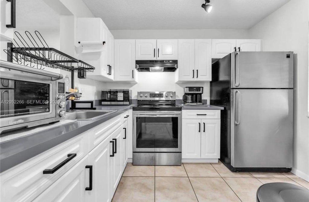 Photo of 8720 N SHERMAN Circle #101, Miramar, FL 33025 (MLS # B26092244)