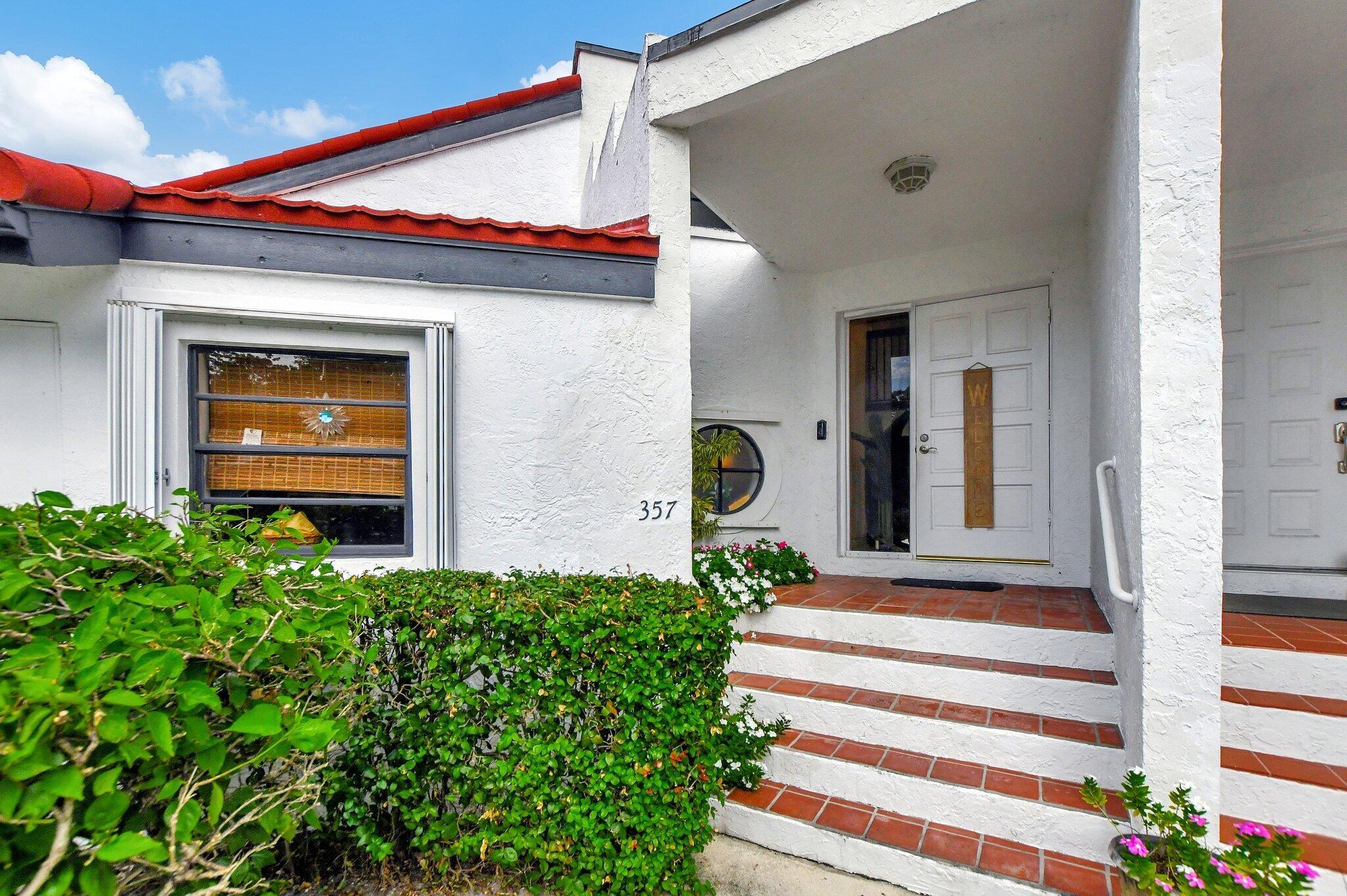 GRAB YOUR SLICE OF PARADISE with this beautiful townhome in a prime location! Come see this stunning 2 bedrooms 2.5 bathroom townhome featuring a remolded kitchen, porcelain floors and oversized screened patio. From your patio, enjoy the tranquil backyard leading into a peaceful canal. Downstairs laundry room has full-size washer/dryer and has great storage space throughout with an extra storage shed in the back, Low HOA fees!!! Close to shopping, dining, parks, beach, and more! View this townhome today and see yourself in your new home!