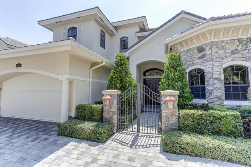 You will not be disappointed with this home with first floor master plus den. Home also features impact windows, a 2-story stone and wood fireplace, built-in entertainment center, custom master closets, upgraded stair railings, as well as upgraded wood floors in master bedroom, den, stairs, and loft. An expanded paver patio with electric retractable awning and swinging fence opens the patio to the huge yard with tether ball, horseshoe courts, and a mosquito spray system for an enjoyable playtime. A paver circular driveway was added along with pathway from front to the backyard. A privacy wall with water feature off the dining room provides a private sitting area. Fully built out wet bar with large wine chiller makes this home perfect for entertaining! Offered fully furnished for $1,100,000