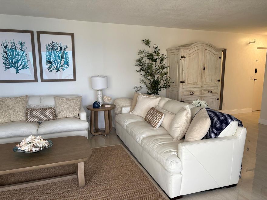 fabulous high floor east view from this newly renovated condo on the wide section of Singer Island Beach. Walking distance to shops and restaurants. Great place to spend fall and winter.