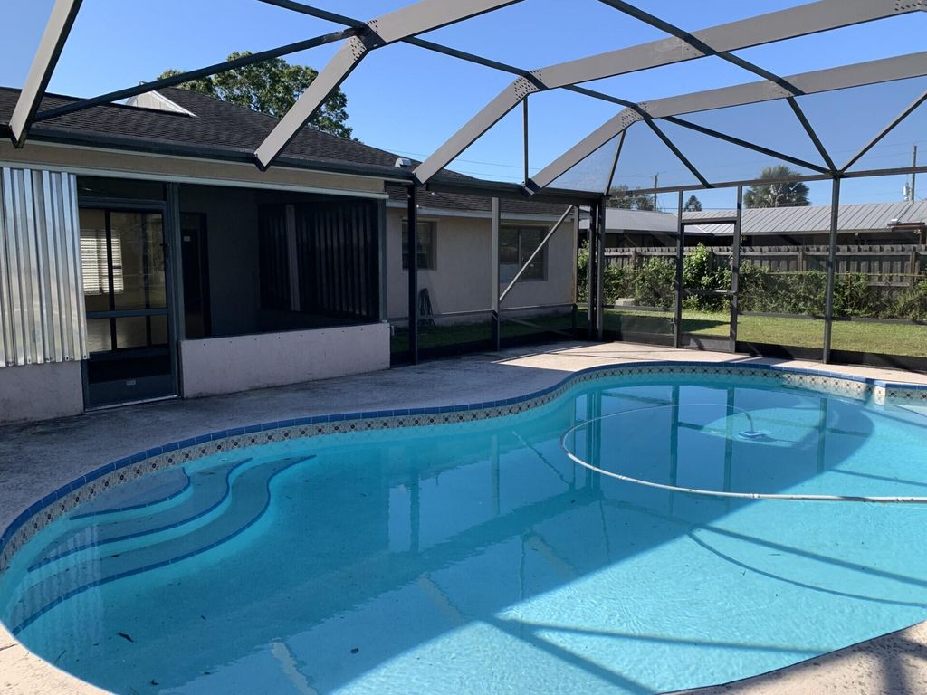 Photo of 201 SE Walters Terrace, Port Saint Lucie, FL 34983 (MLS # R11137256)