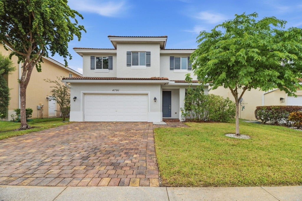 Photo of 4791 Foxtail Palm Court, Greenacres, FL 33463 (MLS # B26077941)