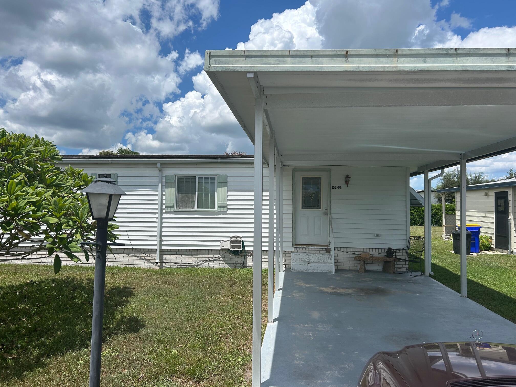 3/2 manufactured home in St Lucie Falls. Enjoy an active lifestyle or relax in this active well planned 55+ recreational community with pool, clubhouse, tennis, bocci, shuffleboard & many other planned activities. This well maintained 3 bedroom, modular home has an open floor plan with oversized rooms. Attached shed with laundry. This unique 3 bedroom model has central air and has a large foyer that can be used for an office, family room or storage! Large yard, pets ok, pickup trucks ok (non commercial). Basic cable included.