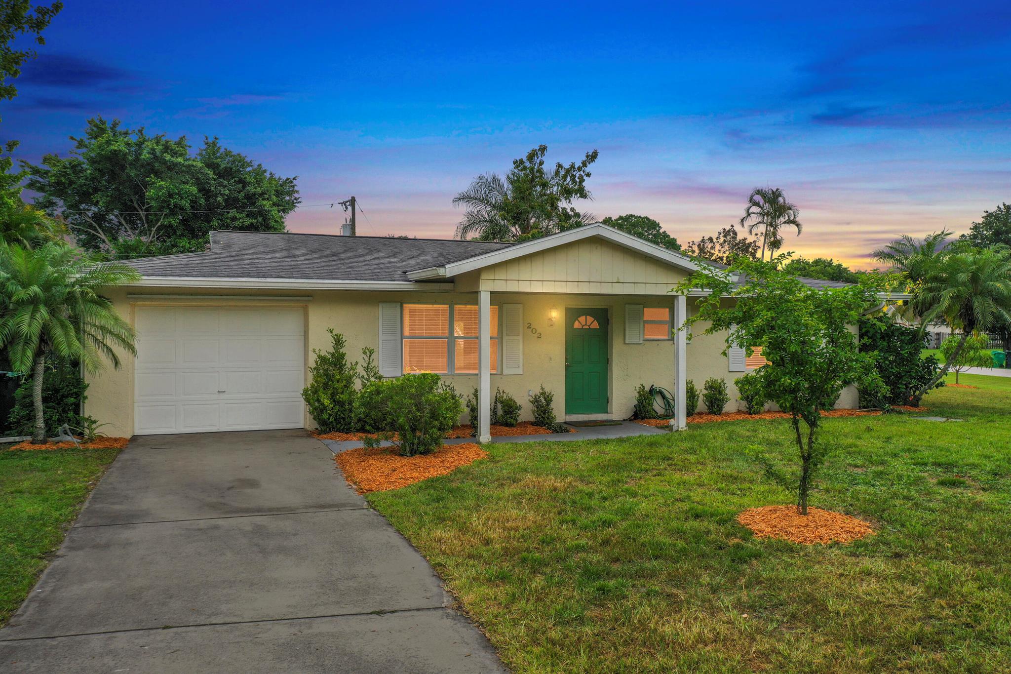 Rare find - home nestled on 1/3 acre corner lot that includes banana trees, Jamaican cherry trees, pineapples, rosemary, and bottlebrush tree. 2BR 2BA home has tile throughout, Florida room, and large screened porch. City water and sewer, well for irrigation. New roof in 2018 and hurricane shutters give peace of mind. HVAC installed in 2018.