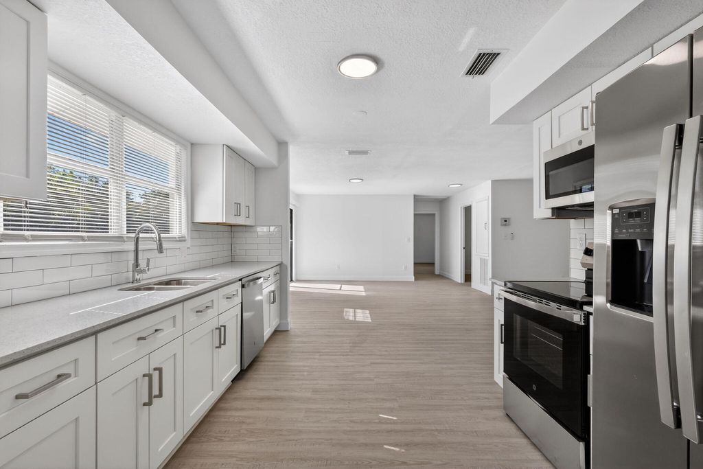 Photo of 17296 W Sycamore Drive W, The Acreage, FL 33470 (MLS # R11153097)