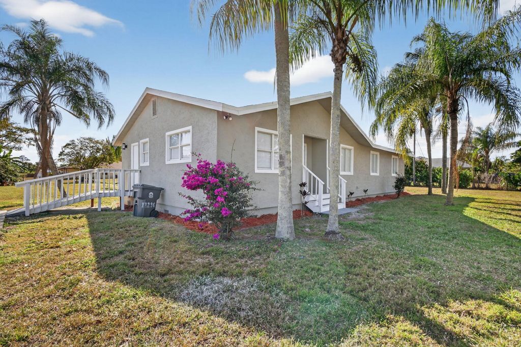 Photo of 17296 W Sycamore Drive W, The Acreage, FL 33470 (MLS # R11153097)