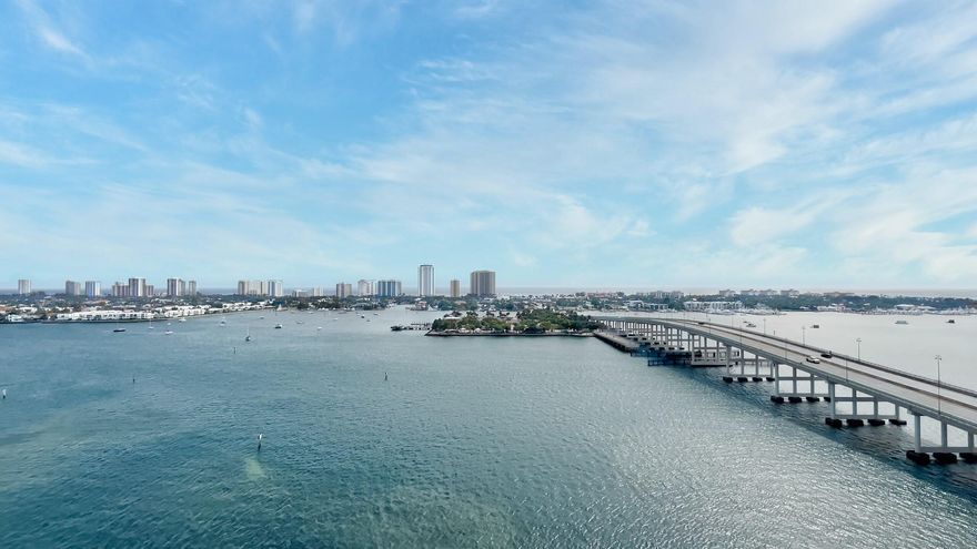 Come see the AMAZING expansive intracoastal and ocean views from this desirable 17th floor home. SPACIOUS 3 bd 3 1/2 bath condo includes 9ft hurricane impact floor to ceiling sliders and windows, authentic large marble floors throughout, NO CARPET, new base and door casing through-out, new toilets, fans, and frameless shower doors. Contemporary kitchen w newer SS appliances, coordinating designer backsplash. Assigned garage parking and climate-controlled storage unit. HOA includes 24 hr. security, cable, internet, valet, water, sauna & steam rm, fitness center, pool, hot tub, tennis/pickle-ball courts, billiard rm, social rm. Publix steps away & full service marina adjacent to the complex. This complex is the best hidden gem in Palm Beach County!!