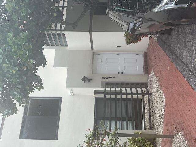 Beautifully remodeled 3 bedroom 3 bath town home directly across from the beach and steps from Palmetto Park Rd restaurants! Open floor plan with one Bedroom downstairs and the Master and third bedroom upstairs. Big balcony with tree top views. Fully renovated unit with all impact windows, new AC, new kitchen and wood floors. Nice private fenced in backyard which will include a barbecue. Only 4 units in this private enclave!