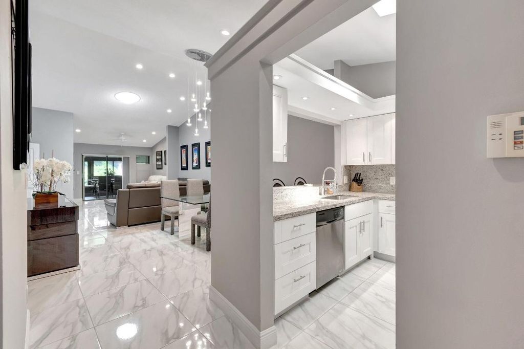 Photo of 10927 Dolphin Palm Court #A, Boynton Beach, FL 33437 (MLS # R11063033)