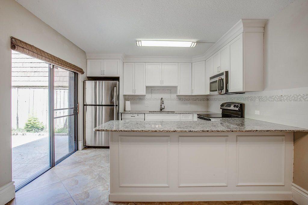 Photo of 204 2ND Court, Palm Beach Gardens, FL 33410 (MLS # B26075878)