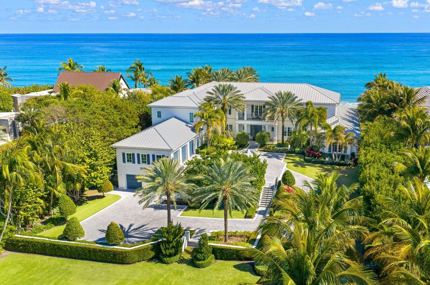 Stunning Ocean-to-Lake estate set on an oversized, premier Manalapan lot with 150+/- feet of direct ocean frontage. This exceptional residence seamlessly captures the essence of what is demanded in a beachfront dream home. Sweeping water views showcased from all principal rooms, expansive waterfront balconies, and spectacular outdoor living areas including an oceanfront loggia overlooking the 64' swimming pool with spa. The estate features 7 bedrooms, 7 full and 3 half baths, a library, elevator, club room, wine cellar, and an impressive 7-car garage, delivering a rare blend of scale, craftsmanship, and coastal luxury.