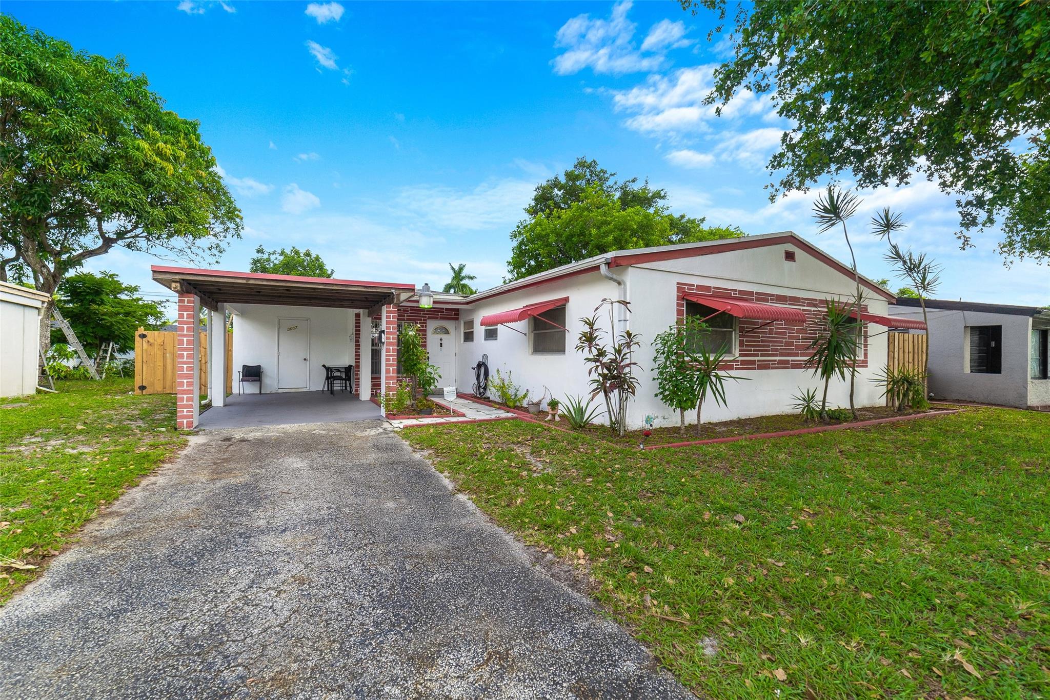 This charming 3-bedroom, 2-bathroom home offers 1,116 sq. ft. of living space on a spacious 6,006 sq. ft. lot. The inviting screened-in pool is perfect for relaxing or entertaining. With original Terrazzo floors under the carpet, this home holds a lot of potential and character. Located in a convenient area close to shopping, dining, and parks, it’s the ideal place to enjoy easy access to everyday amenities. Whether you're looking for a home with room to grow or just a peaceful retreat, this property is a fantastic opportunity at an unbeatable price.