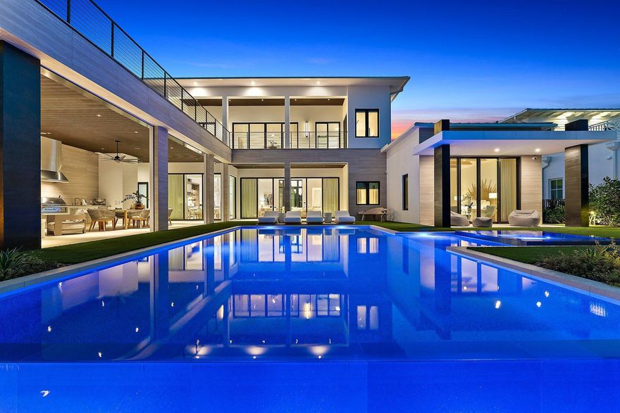 There is a beautiful California vibe in this uniquely styled, brand new construction, directly on the Intracoastal Waterway in a no wake zone, and on one acre, just South of Donald Ross Road.  12 foot ceilings throughout the first floor offer amazing views to the pool, expansive lawn, and deep water.  White Oak floors warm the spaces, and walls of glass windows and doors keep the home light and bright.  The primary suite and one guest suite are on the main floor, and two additional suites, plus a large loft area with wet bar, and den, occupy the second floor.  There are two laundry rooms in the home, three half baths, an elevator, wine room, Savant system, and a three car garage.  Best of all, there is an additional lot included to the West with plans for a three bedroom guest house.