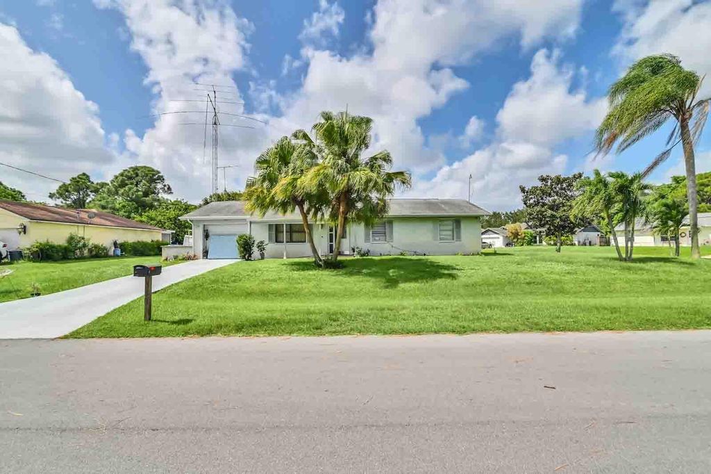 Photo of 2102 SW Wayne Street, Port St Lucie, FL 34984 (MLS # R10929061)