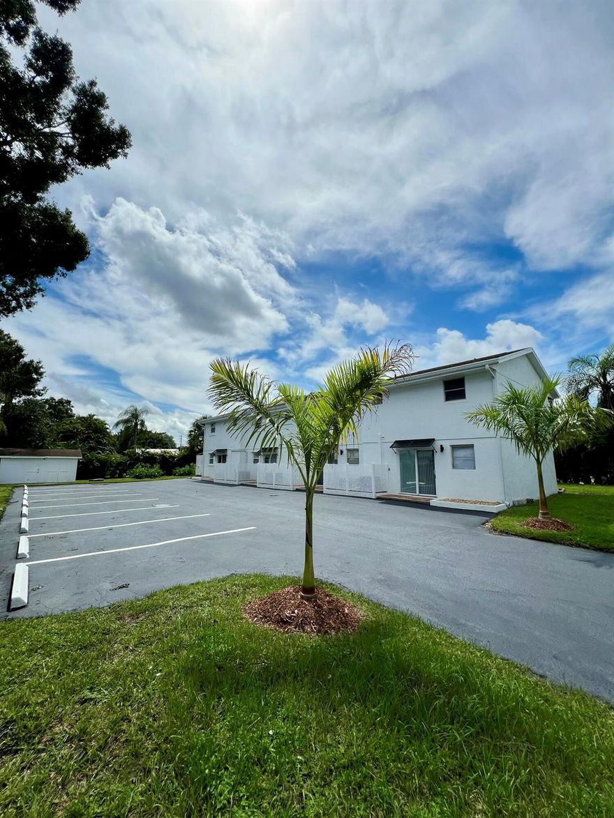 Beautifully updated 2 story townhouse style unit. This home is located on a beautiful quiet street steps away from the intercostal and Charlie Leighton Park. The interior features an updated kitchen, newer stainless steel appliances, washer/dryer, quartz countertops, new floors, updated bathrooms, freshly painted, new doors, fixtures, faucets, and more! Relax out back on the upstairs balcony. Have you ever heard of Grow Inn Homes (do a google search for more information)? The landscaping includes many different tropical fruit trees for residents to enjoy the fresh produce grown right outside their door! Currently tenant occupied so please do not disturb them. Property will be available February 2, 2026