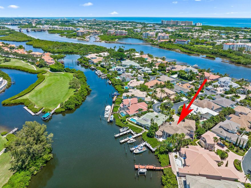 RARELY AVAILABLE Deepwater Home w/ 80' Perpendicular Dock in Beautiful Jonathan's Landing - one of Jupiter's finest Country Club/Marina communities.  This grand 'double dock' home sits on a Prime Cul de Sac lot in the coveted Casseekey Island section, a true Boater's Paradise.  Easy (10 minute) Ocean access w/ NO FIXED BRIDGES!   This custom residence was Renovated by Willoughby Homes, one of the areas premier builders.  Mahogany+Glass double door entry leads to a two story living room w/ bright + airy interiors featuring Saturnia flooring + custom built ins.  Renovations include Impact Windows+Doors, Smart Home lighting and sound system, 2016 roof, upgraded Chef's kitchen (Wolf + Dacor appliances) and 2 tankless water heaters.   In addition to over 6,000 living sq. ft....