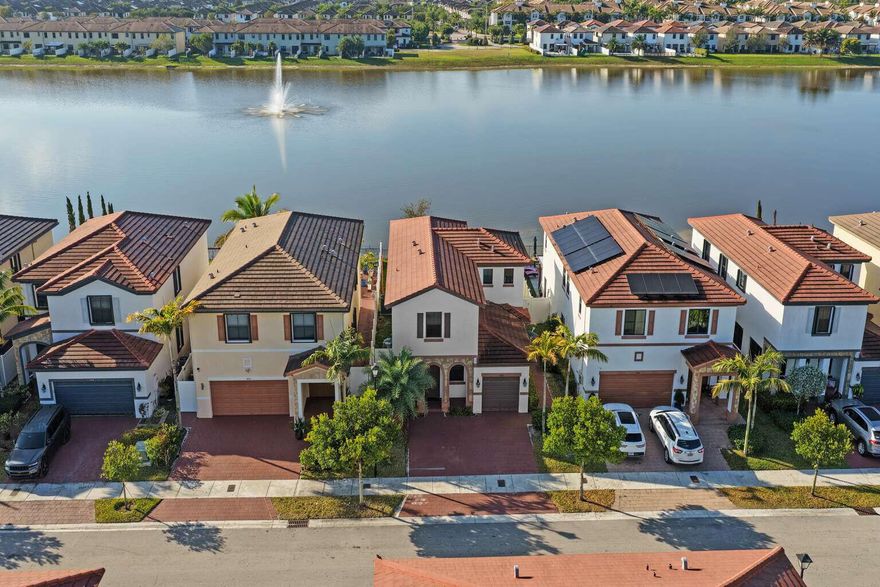 Mediterranean architectural style, waterfront 4Bedroom, 3.5Bath Home with Private Guest Suite & ResortStyle Living in Aquabella. Discover a rare opportunity to own a waterfront residence in one of MiamiDade's most desirable gated communities. Built in 2017 and overlooking a tranquil lake, this 2,571 sq. ft. home blends modern comfort with exceptional flexibility—highlighted by its fully independent MotherinLaw / Guest Suite / private office with separate secondary entrance, offering unlimited potential for multigenerational living, or a private retreat for longterm guests. Step inside to an airy, openconcept main living space where high ceilings and frame sweeping water views. The living and dining areas flow effortlessly into a contemporary kitchen designed for both daily comfort  and effortless entertaining. Every room feels connected to the serene beauty of the lake outside. The beautifully furnished backyard extends your living area outdoors, offering a peaceful, lowmaintenance oasis perfect for morning coffee, evening relaxation, or gatherings with family and friends—set against the calming waterfront scenery. One of the standout highlights of this home is the fully permitted private efficiency suite, complete with its own bedroom, full bath, kitchenette, fridge, living area, and dedicated washer/dryer. With its own separate entrance, this suite provides exceptional versatility and privacy—truly a luxury within the community. Parking is another advantage: a spacious 4car driveway plus a 1car garage offer abundant room for residents and guests. Additional guest parking is conveniently located directly across the street—an uncommon and highly valuable benefit within the neighborhood. Additional Features Include: Panoramic lake views from the main living spaces. Modern 2017 construction in excellent, moveinready condition. Stylish, furnished, lowmaintenance backyard designed for outdoor living. Located in a secure, gated with security guarded community. Aquabella offers a lifestyle centered on comfort, relaxation, and recreation, featuring 24/7 security, a clubhouse, gym, playgrounds and scenic walking trails. Enjoy easy access to I75, SR826, shopping, dining, and schools—everything you need just minutes away. This exceptional property brings together beauty, function, and flexibility, Modern lakefront multigen home creating a home where lasting memories can be made for years to come.