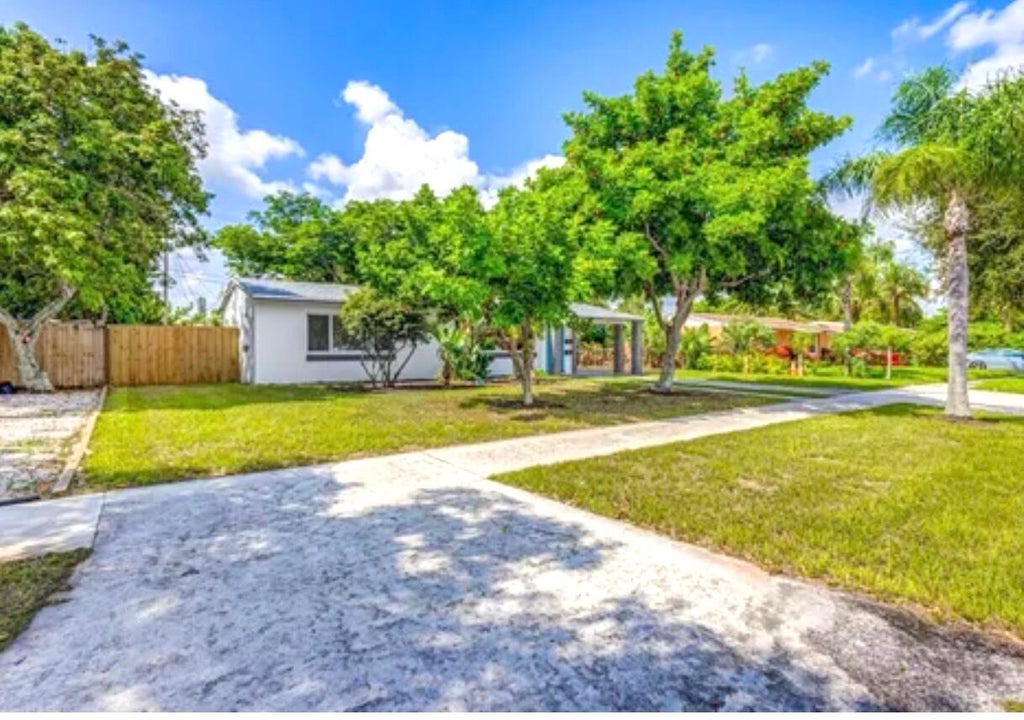 Photo of 512 BAYBERRY Drive, Lake Park, FL 33403 (MLS # B26068985)