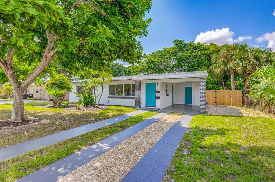 Photo of 512 BAYBERRY Drive, Lake Park, FL 33403 (MLS # B26068985)