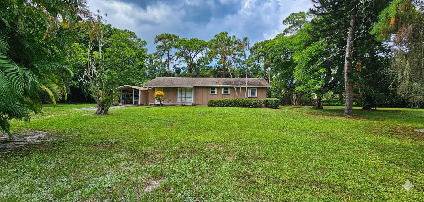 Unlimited possibilities await with this unique Delray Beach property, set on 1.05 acres with mature fruit trees and over 1,400 sq. ft. of living space. The existing 1979 single-story residence offers a strong foundation for renovation, expansion, or the creation of your dream estate. Zoned AR (Agricultural Residential), the land allows flexibility for redevelopment, gardening, or hobby farming, all within minutes of vibrant Atlantic Avenue, award-winning beaches, shopping, dining, and cultural attractions. Delray Beach continues to thrive as one of South Florida's most desirable cities, offering steady growth, strong demand, and long-term value. The photos are AI-edited to remove clutter elderly owner is unable to manage until sold. A post-closing occupancy would be ideal for the seller!