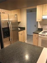 Spacious 2 bed, 2 bath unit in The Prado Condominium for rent. This well-maintained unit features tile flooring throughout and is in good condition. The building offers a common laundry facility room on each floor. Conveniently located near major highways, shopping centers, dining, and more.