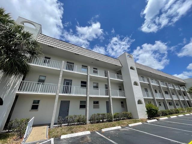 Beautifully upgraded 55+ Community unit in phase 2 Property features: New kitchen Counter ,Newer refrigerator, range, Enlarged pass through window, Ample "extended" living/dining room facing the lake, Large bedroom and huge walk-in closet, Full bathroom, additional storage, Steps from the elevator and laundry room, Assigned parking and plenty of guests parking , Shuttle bus and security patrol , Quiet community with tons of amenities. Minutes away from Publix, City of Sunrise Library, City of Sunrise Civic Center, 7 minutes away from Sawgrass Mills Mall, Bank of America