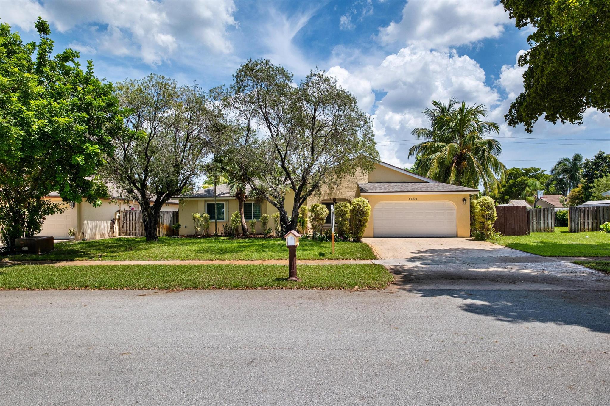 No HOA Approval, Fast Move In! Situated on a spacious 10,000 SF lot, this home offers a private backyard with a large pool, low maintenance turf, a covered concrete patio, and a built in bonfire area for relaxing evenings under the stars. Enjoy peace of mind with hurricane impact windows paired with accordion shutters for additional protection. Inside, you'll find two living areas, a dedicated dining space, and a versatile bonus room perfect for a pantry or small office. The master and guest bathrooms have been updated, and the kitchen features granite countertops with a beautiful view of the pool. Just a short walk to the park. Located near top-rated A+ schools, this home is ready to welcome you!