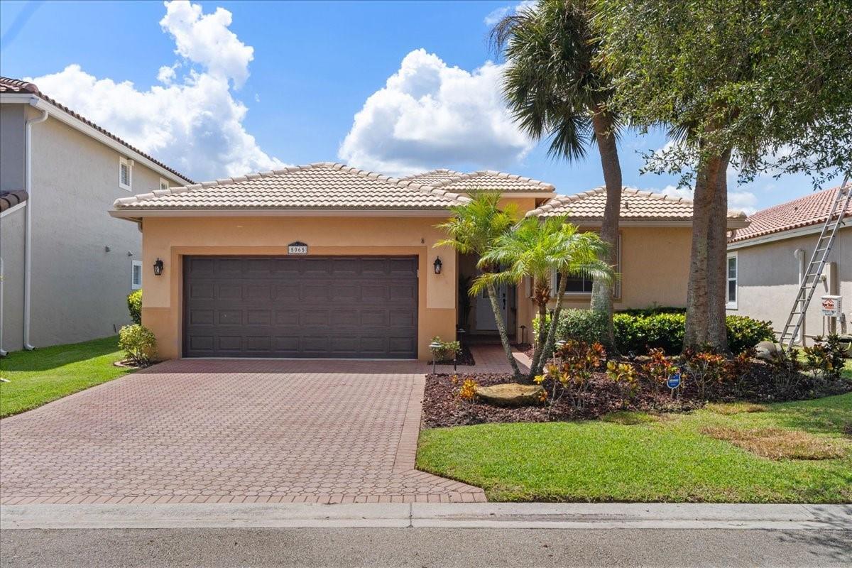 Amazing Deal! One of the best water views in all of Wyndham Lakes! Zoned for A+ rated schools including Stoneman Douglas HS, deals like this don't come around too often. Featuring an updated kitchen with real wood cabinets, stainless steel appliances, & granite countertops. Beautiful water views from your large family room & living area. The primary bedroom has a large walk-in closet w/ custom built-ins. It can fit all your furniture including a king-sized bed w/ water views and a sliding door out to the pool. All bedrooms generously sized with plenty of closet space. Washer & Dryer inside the house - not in the garage. 2nd bathroom was beautifully redone with modern finishes. HUGE screened in patio is great for entertaining or bug-free BBQs all year round. Accordion shutters & 2021 AC