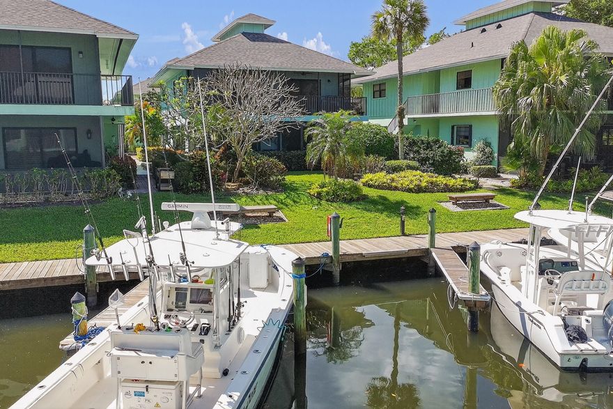 Experience the ultimate in waterfront living with this 2-bed, 2-bath first-floor condo in the highly desirable Mariner Cay community—where your boat is quite literally just steps from your back door. The standout feature of this property is its unbeatable proximity to the dock and canal. Step out from your screened-in porch and you're immediately at your boat, with dockage available for vessels up to 30 feet (rental at $2/ft/month). With no bridges to navigate, you'll enjoy quick, direct access to the Intracoastal, St. Lucie Inlet, and the open ocean within minutes. Inside, the condo features an updated kitchen, newer flooring, accordion shutters, new impact-rated front door, A/C (2016), water heater (2024), and a newer roof (2021). Mariner Cay offers a secure, resort-style lifestyle... with a 24-hour manned guard gate, two pools (1 heated), a waterfront clubhouse, tennis and pickleball courts, and a 52-slip marina with fuel service for boats up to 50 feet. Dockage is available on a first-come, first-served basis. Ideally located, you're within walking distance to Sandsprit Park and just minutes from the popular waterfront restaurants and entertainment of the Manatee Pocket. If effortless boating access is what you've been searching for, this is the one.