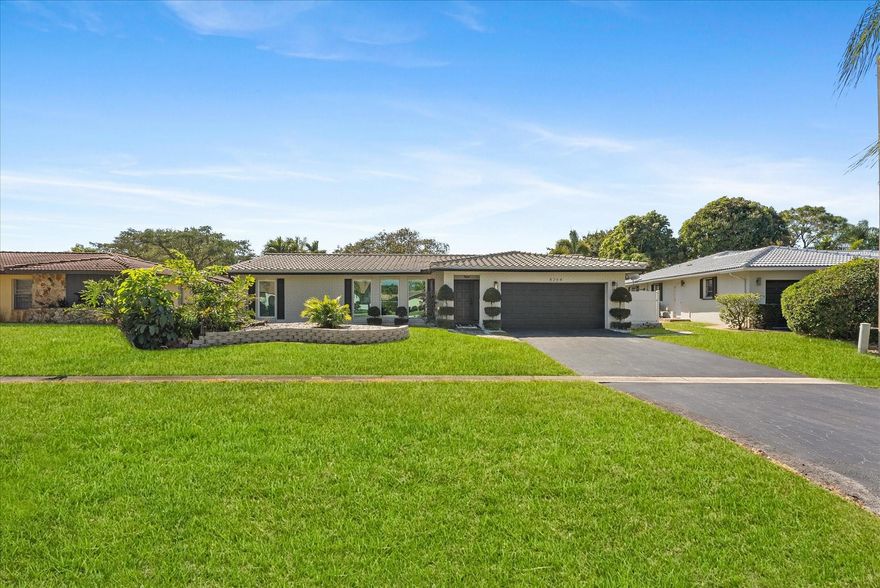 Simply beautiful, updated waterfront home with ALL IMPACT WINDOWS/DOORS. An Impeccable curb appeal hints to how special it is. A perfect blend of modern yet timeless, relaxed yet sophisticated. A crisp light & airy interior opens with contrasting light & dark finishes. Expansive great room is filled with soft natural light from triple wall-to-ceiling impact windows. The spacious kitchen & dining area has a large island, lots of wood cabinetry, granite counters, top-tier appliances & wine cooler. Multiple windows & glass doors for serene water views thruout & indoor/outdoor living. A fenced backyard is a private paradise with a screened porch, saltwater pool, barbecue, outdoor shower & wide waterfrontage. Other offerings:  all updated baths, fabulous lighting, a laundry room.