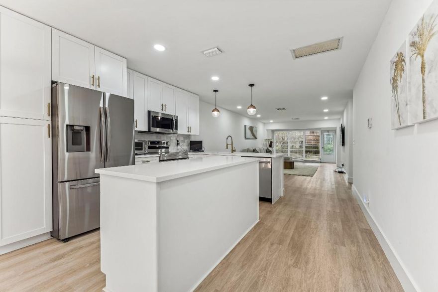 Contemporary and beautifully renovated, this well-located and spacious 2 bedroom and 2 bath at Palm Greens is a must see! Brand-new from the floors to ceilings. Bright and open-concept kitchen with double island, pantry, and plenty of storage. All new stainless steel appliances including brand new water heater. Both bathrooms with modern vanities, frameless showers and neutral color tones. The master bathroom features a double vanity and two walk in closets. Enjoy the privacy of a large paved patio plus screened in patio. This corner unit is very private with a large green space in the backyard. Park directly in front. Palm Greens is a fabulous, active 55+ community, including Tennis, pool, Clubhouse, and lots of activities.