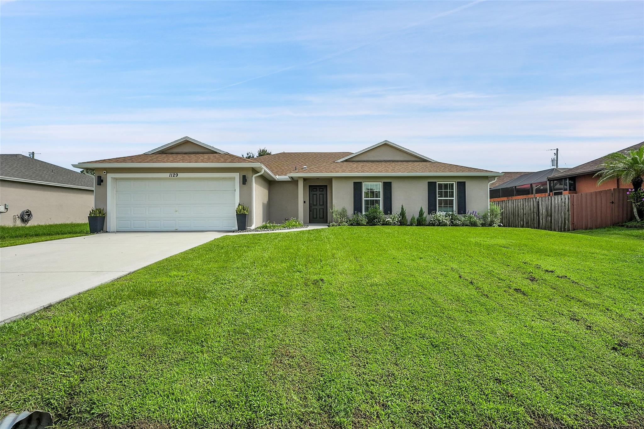 Discover your dream home in the heart of Port St. Lucie. This home is a magnificent 4/2 designed for modern living & makes for an ideal sanctuary for everyone. The fully fenced backyard provides privacy, perfect for outdoor gatherings or relaxation. Step inside to find a spacious open floor plan that seamlessly connects & is tailored for both entertaining & everyday living. The gourmet kitchen features SS appliances & granite countertops, inviting culinary creativity. The covered patio serves as an ideal space for morning coffee and there is a HUGE fenced in yard. Embrace the vibrant community, complete with growing amenities, offering a lifestyle upgrade. You’ll want to make this home yours immediately. Schedule your private tour today & experience the relaxed lifestyle of Port St Lucie!