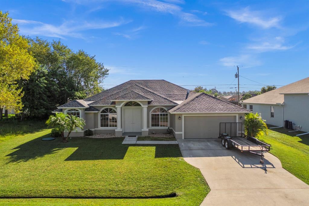 Photo of 1949 SW Glendale Street, Port Saint Lucie, FL 34987 (MLS # R10756897)